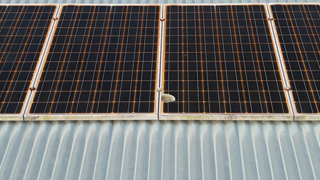 Detailed aerial close-up of a solar panel array on a Brisbane roof
